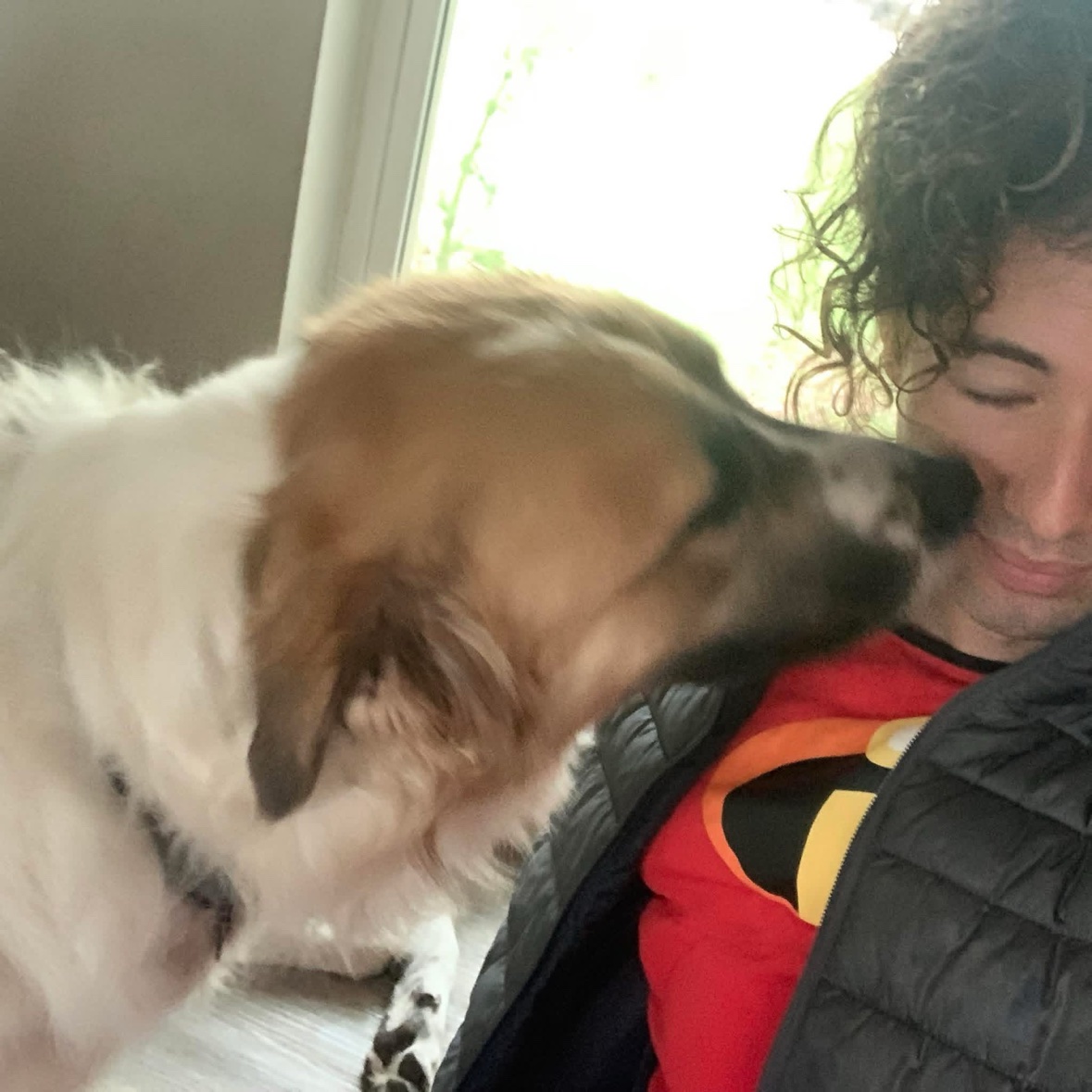 Josue with a client's dog at home